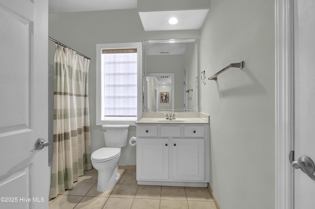 bathroom with tile patterned flooring, vanity, a shower with curtain, and toilet