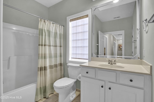 full bathroom with a healthy amount of sunlight, shower / tub combo with curtain, tile patterned floors, and vanity