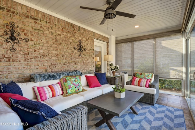 sunroom featuring wood ceiling and ceiling fan