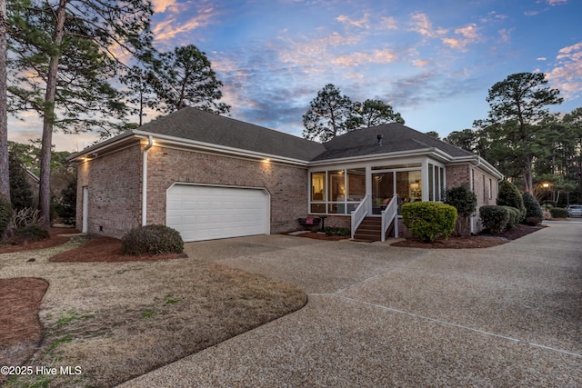 view of front of house featuring a garage and a porch