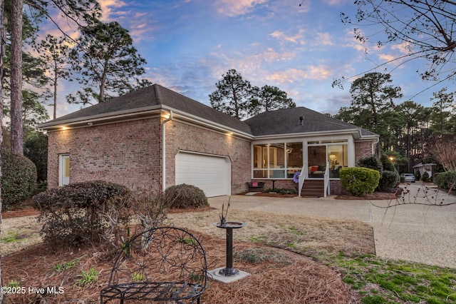 ranch-style home featuring a garage