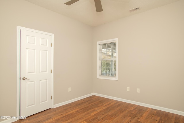 spare room featuring hardwood / wood-style floors and ceiling fan