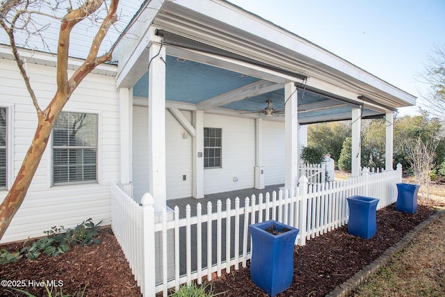 exterior space with ceiling fan and a porch