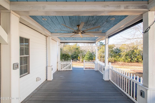 wooden deck with ceiling fan and a porch