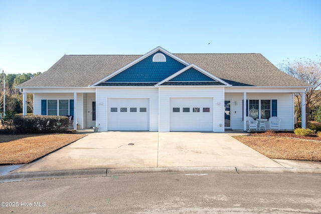 view of front of property with a garage and covered porch