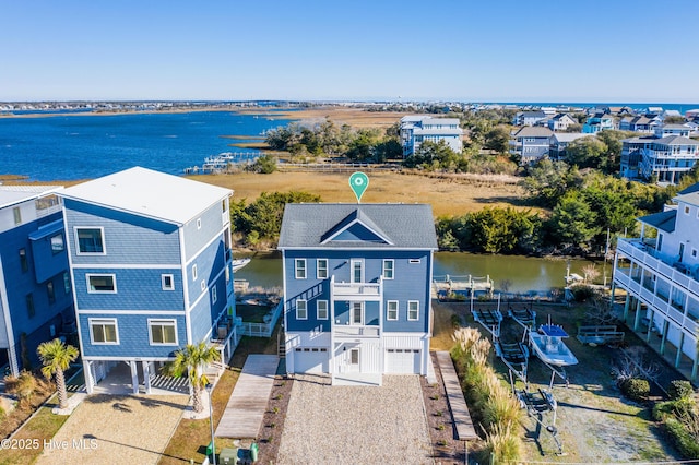 drone / aerial view with a water view