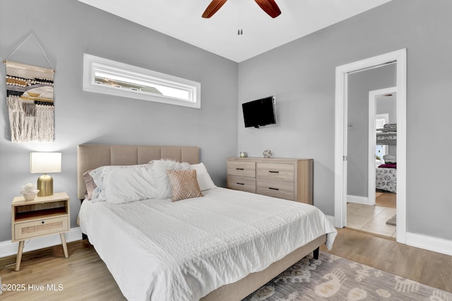 bedroom with hardwood / wood-style flooring and ceiling fan