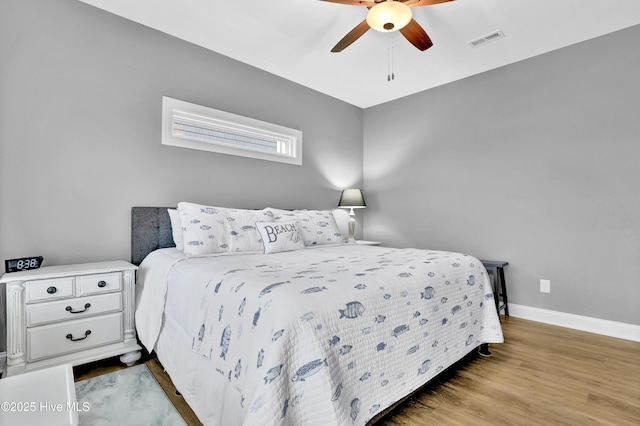 bedroom featuring hardwood / wood-style floors and ceiling fan