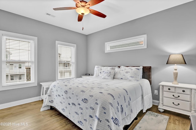 bedroom featuring hardwood / wood-style flooring and ceiling fan