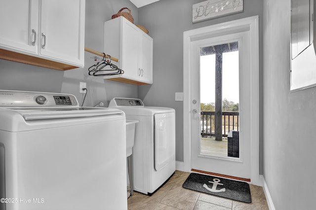 laundry area with cabinets and washer and dryer