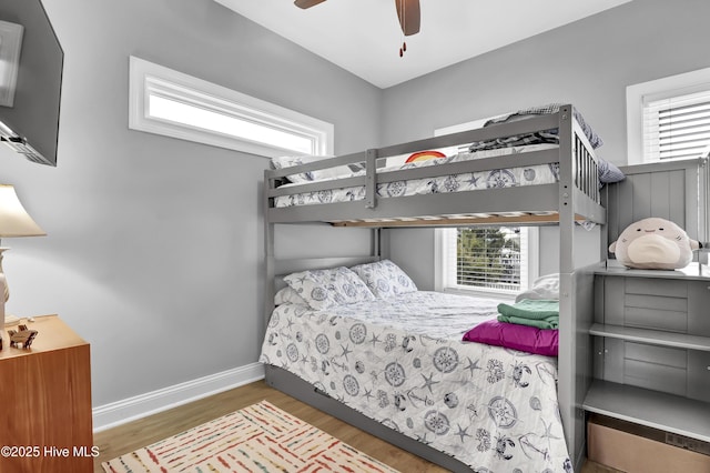 bedroom with ceiling fan and dark hardwood / wood-style flooring