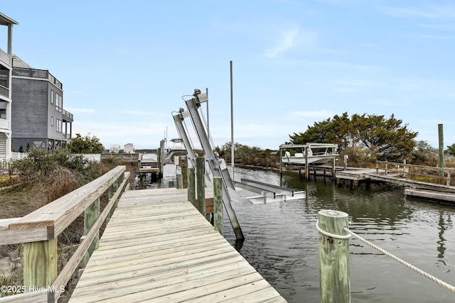 view of dock with a water view