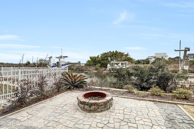 view of patio with a fire pit