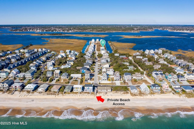 bird's eye view with a view of the beach and a water view