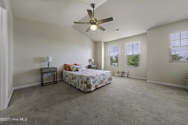 carpeted bedroom featuring ceiling fan, lofted ceiling, and multiple windows