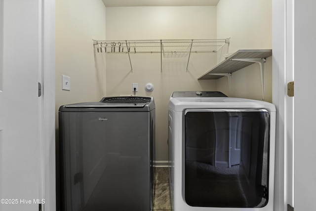 laundry room with independent washer and dryer