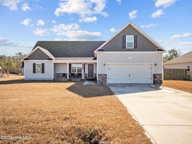 craftsman-style home featuring a garage and covered porch