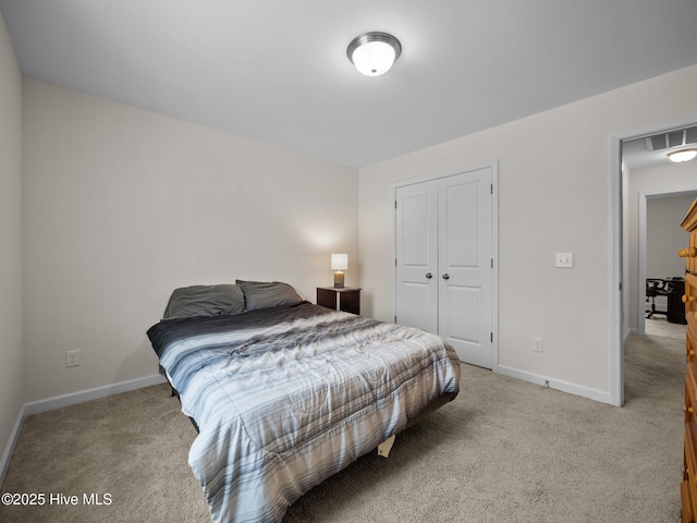 carpeted bedroom featuring a closet