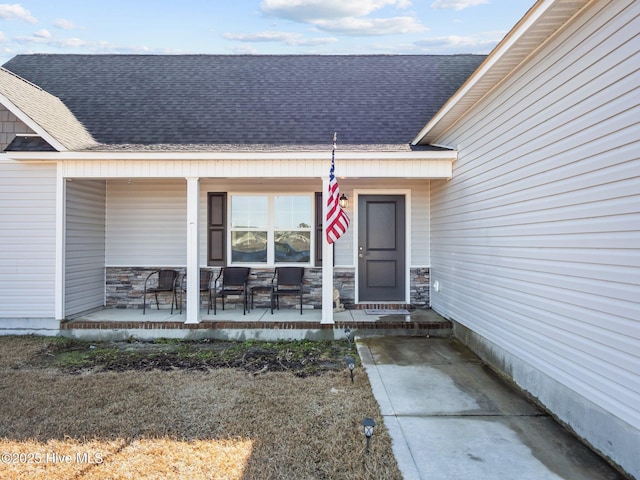 property entrance featuring covered porch