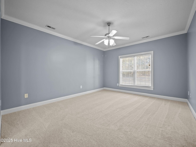 carpeted empty room with ornamental molding and ceiling fan