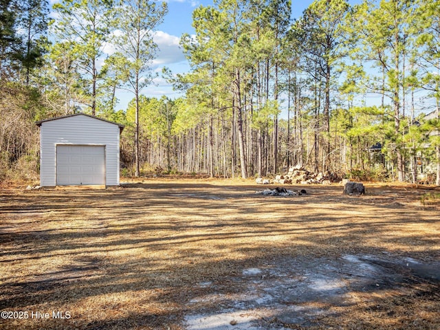 view of yard with a garage