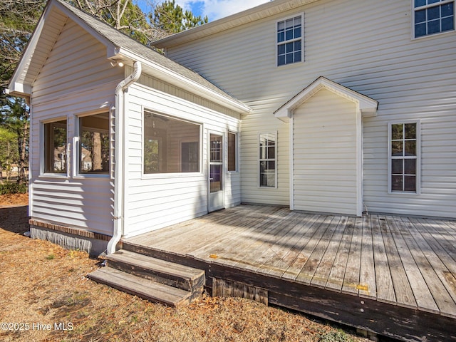 back of property with a wooden deck