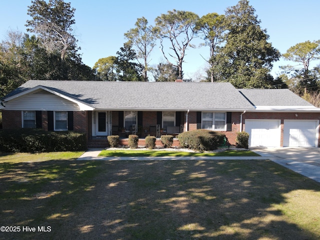 single story home featuring a garage and a front lawn