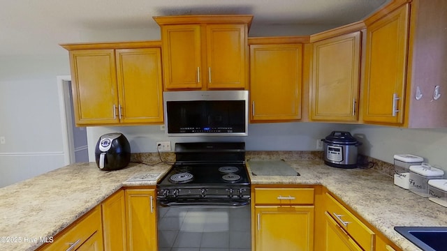 kitchen featuring black electric range