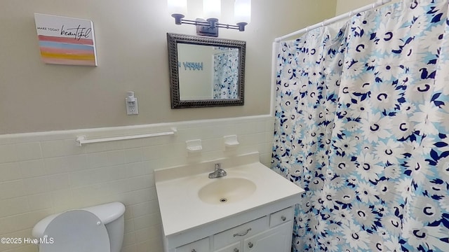 bathroom with vanity, toilet, and walk in shower