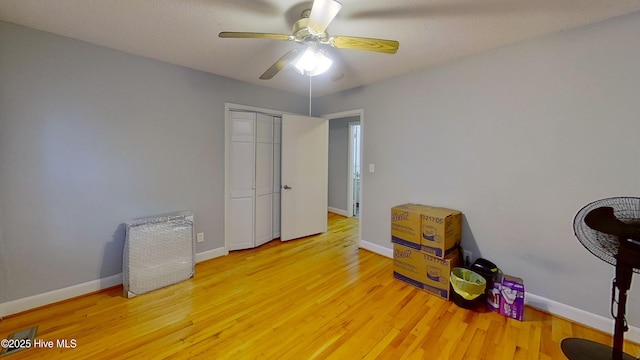 miscellaneous room with hardwood / wood-style flooring and ceiling fan