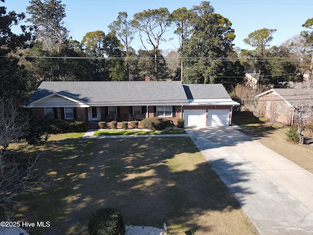 single story home with a garage and a front yard