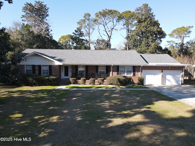 single story home featuring a garage and a front yard