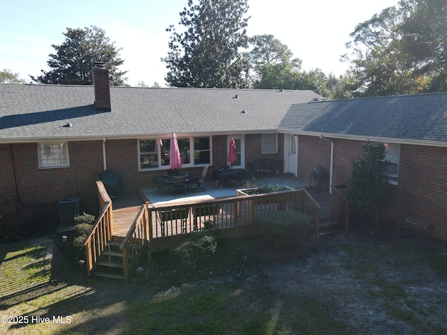 back of house with a patio area and a deck