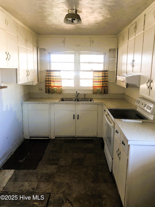 kitchen featuring sink, a textured ceiling, white cabinets, and white range with electric cooktop