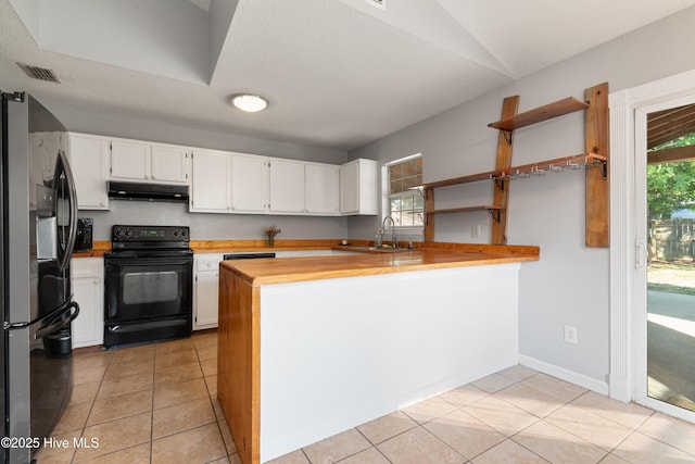 kitchen featuring a sink, open shelves, under cabinet range hood, electric range, and stainless steel fridge with ice dispenser