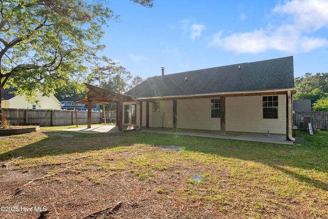 back of house with a lawn, a patio area, central air condition unit, a shingled roof, and a fenced backyard
