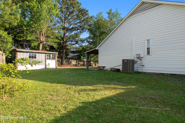view of yard with fence and cooling unit