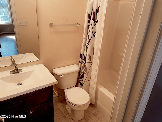 full bathroom with shower / tub combo, vanity, and toilet