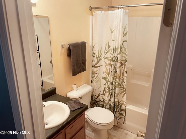 bathroom with toilet, shower / bath combo, and vanity