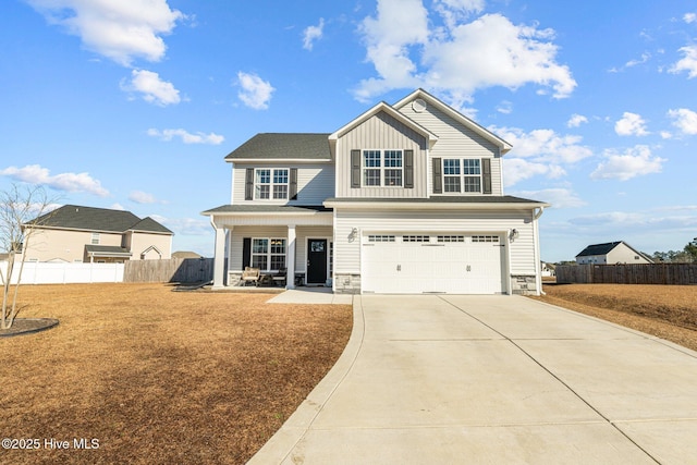 view of front facade with a garage, a front yard, and a porch