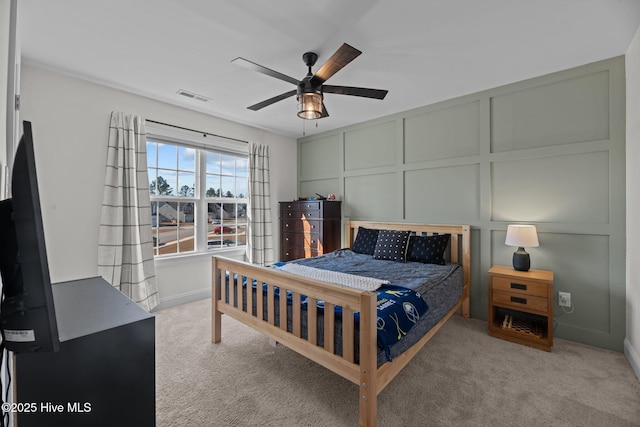 bedroom with light colored carpet and ceiling fan