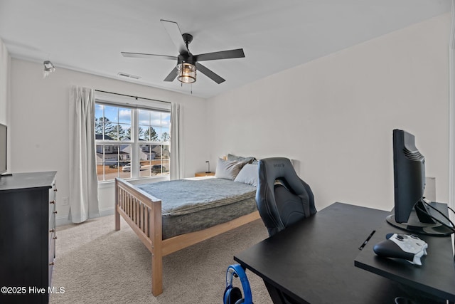 carpeted bedroom with ceiling fan