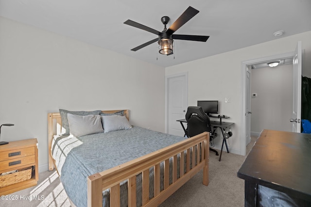 bedroom with light carpet and ceiling fan