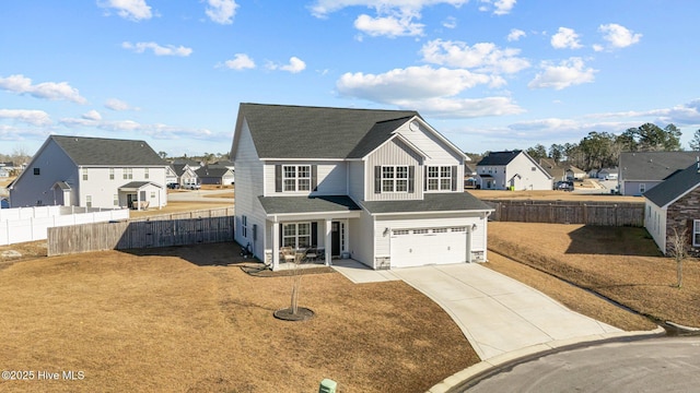 view of front of house with a garage and a front lawn