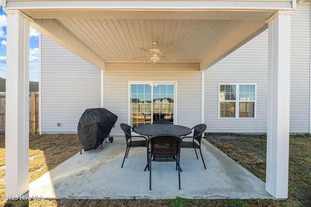 view of patio with ceiling fan and a grill