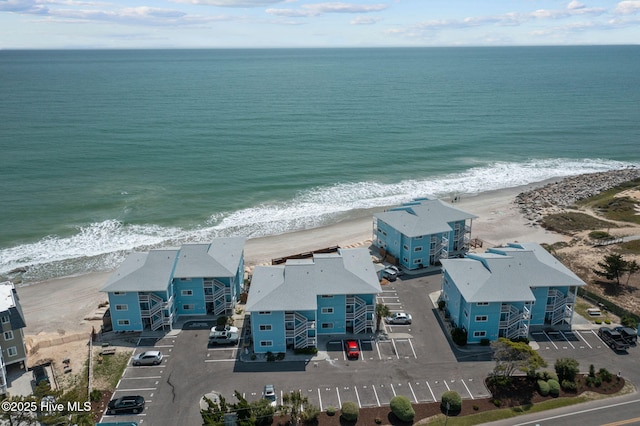 aerial view with a beach view and a water view