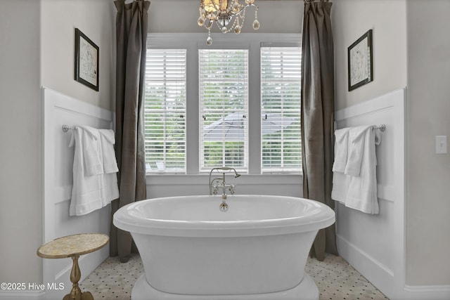 bathroom with plenty of natural light and tile patterned floors