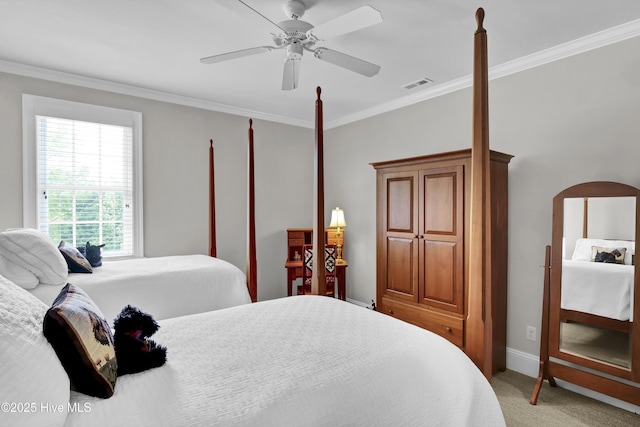 bedroom with baseboards, ceiling fan, visible vents, crown molding, and light carpet