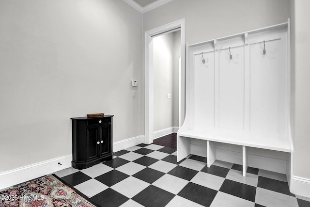 mudroom featuring baseboards, tile patterned floors, and crown molding