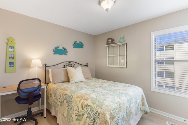 1505 Carolina Beach Ave N Unit 2F, Carolina Beach, NC 28428 - bedroom featuring wood finished floors